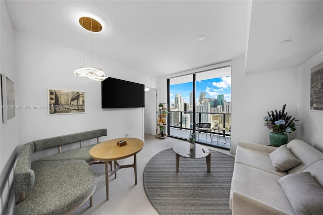 living room with light tile patterned flooring and a wall of windows