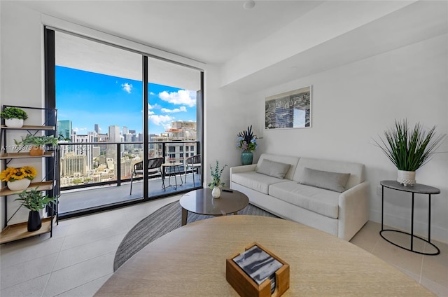 tiled living room featuring a city view and a wall of windows