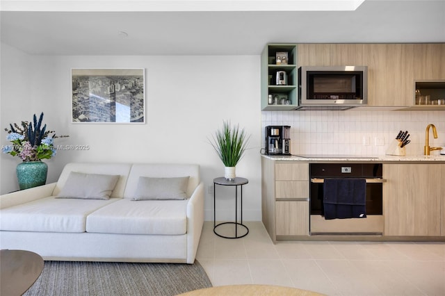 living room with light tile patterned flooring