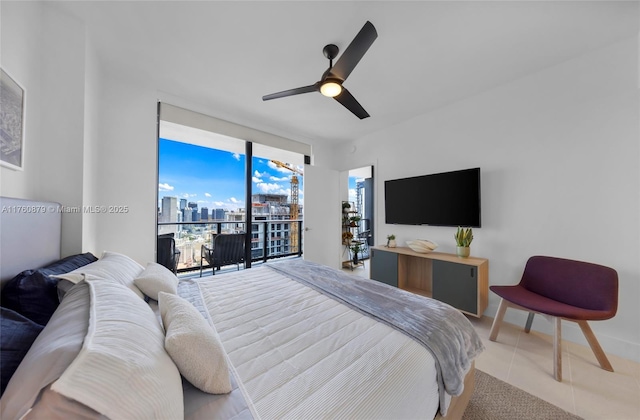 bedroom featuring light tile patterned flooring, a ceiling fan, and expansive windows