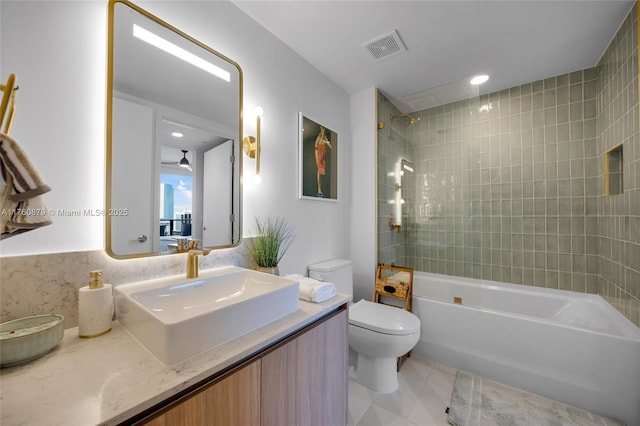 bathroom featuring tile patterned floors, visible vents, toilet, shower / washtub combination, and vanity