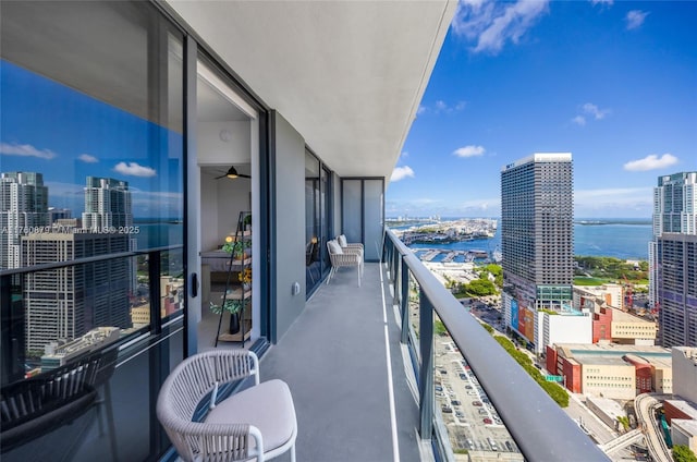 balcony with a city view and a water view