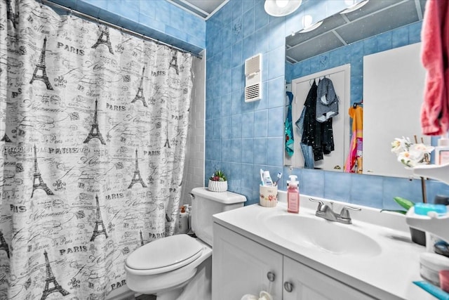 full bath featuring a shower with curtain, toilet, tile walls, and vanity