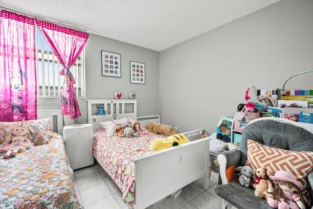 tiled bedroom featuring a textured ceiling