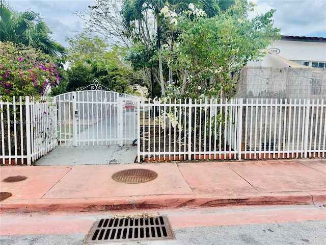 view of gate featuring fence