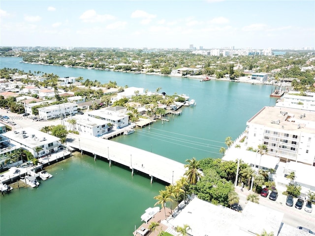 drone / aerial view with a city view and a water view