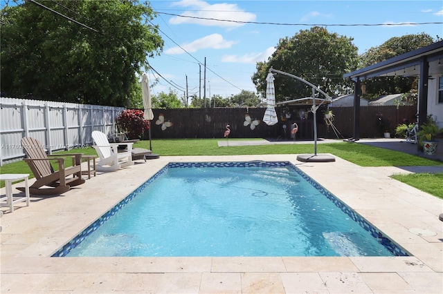 view of pool with a patio area, a fenced in pool, and a fenced backyard