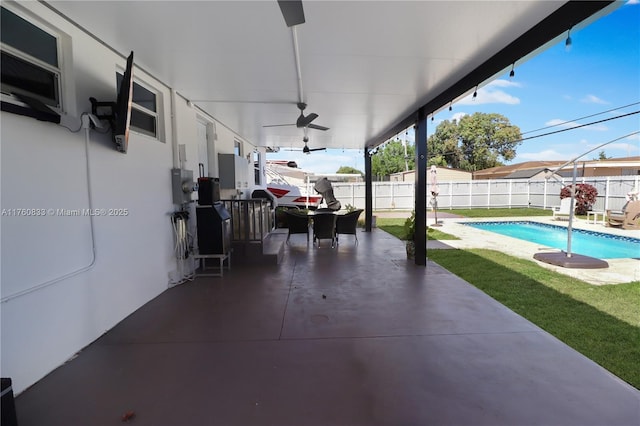 view of patio / terrace with a fenced backyard, a fenced in pool, and a ceiling fan