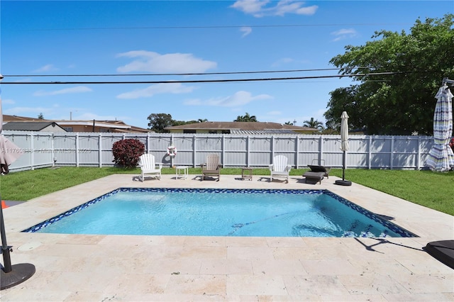 view of swimming pool featuring a patio, a fenced backyard, and a fenced in pool