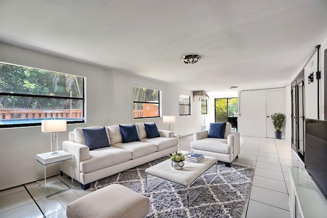 living area with tile patterned floors