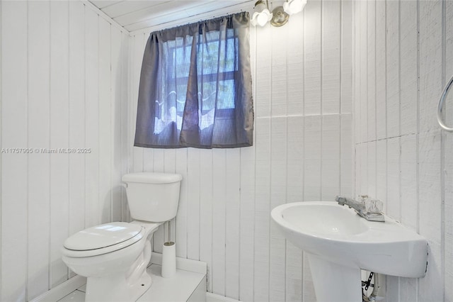 bathroom with toilet and a sink