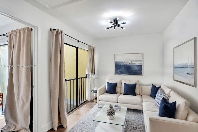 living room featuring a healthy amount of sunlight and light wood-style flooring