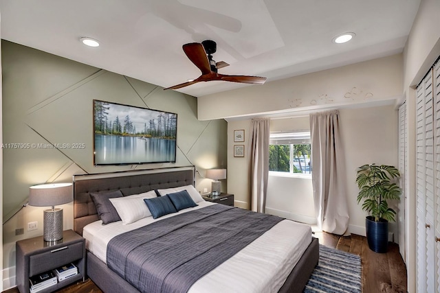 bedroom featuring recessed lighting, baseboards, wood finished floors, and a ceiling fan