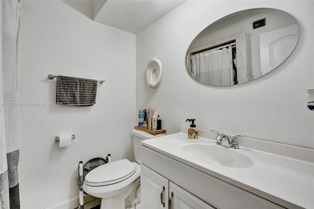 full bathroom featuring toilet and vanity