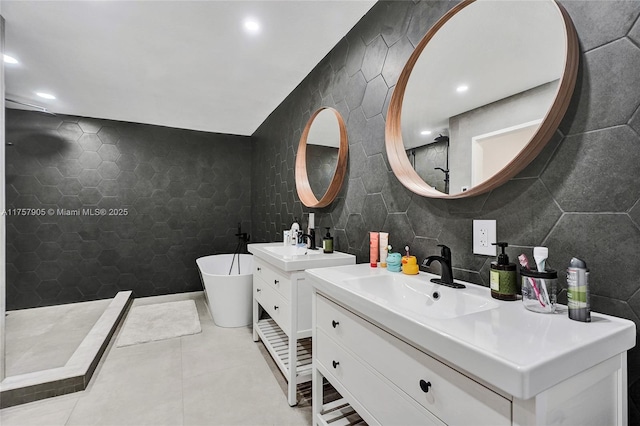 full bathroom featuring a sink, a tile shower, tile walls, tile patterned flooring, and a soaking tub