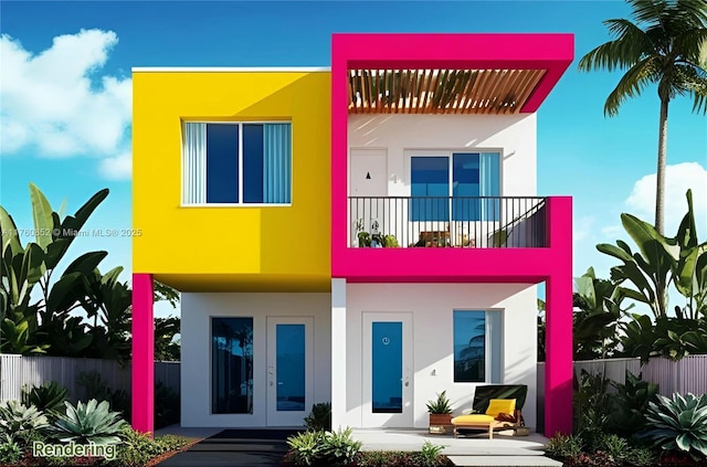 rear view of property featuring a balcony, french doors, fence, and stucco siding
