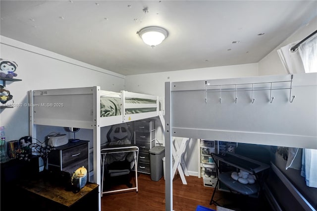 bedroom featuring wood finished floors