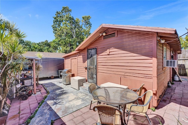 view of patio / terrace featuring cooling unit and fence