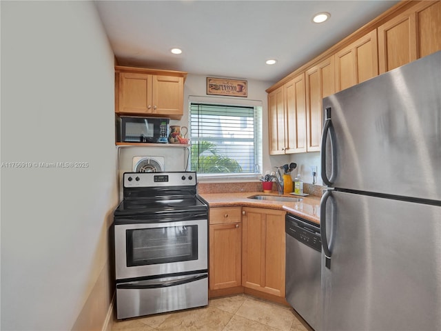 1900 NE 8th Ct Unit 306, Fort Lauderdale, FL 33304 - kitchen featuring a sink, appliances with stainless steel finishes, recessed lighting, and light countertops