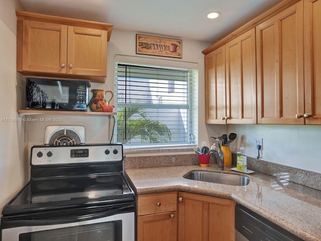 1900 NE 8th Ct Unit 306, Fort Lauderdale, FL 33304 - kitchen featuring a sink, light stone counters, recessed lighting, and stainless steel appliances