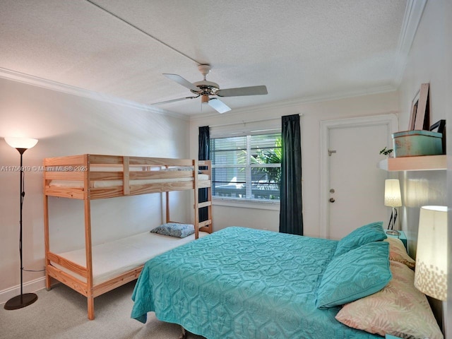 1900 NE 8th Ct Unit 306, Fort Lauderdale, FL 33304 - carpeted bedroom with baseboards, a textured ceiling, ornamental molding, and a ceiling fan