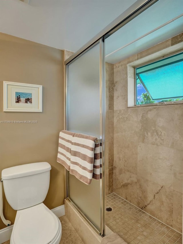 1900 NE 8th Ct Unit 306, Fort Lauderdale, FL 33304 - full bath with a stall shower, toilet, and baseboards