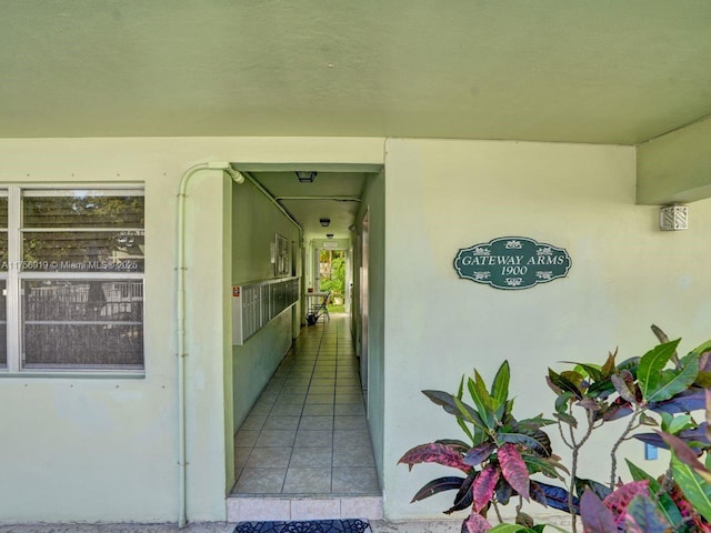 1900 NE 8th Ct Unit 306, Fort Lauderdale, FL 33304 - view of exterior entry with stucco siding