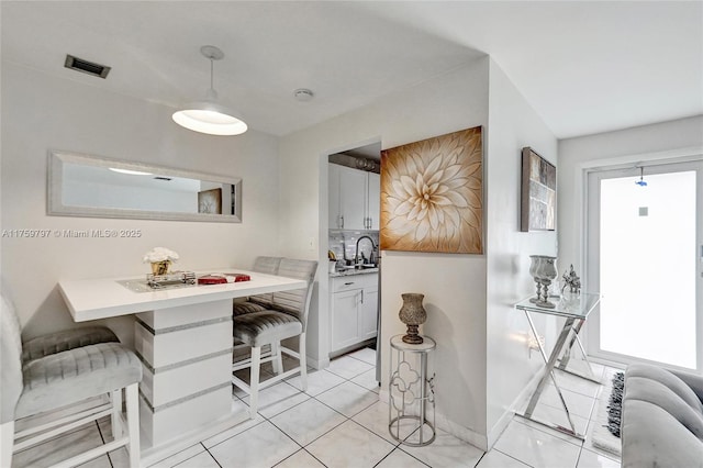 6069 SW 35th St, Miramar, FL 33023 - dining space featuring light tile patterned flooring and baseboards