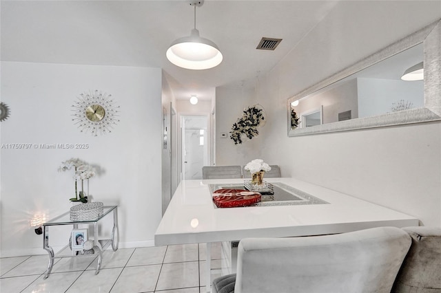 dining space with tile patterned floors and visible vents