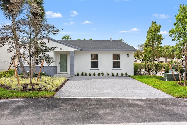 834 Cumberland Ter, Davie, FL 33325 - view of front facade with stucco siding and decorative driveway