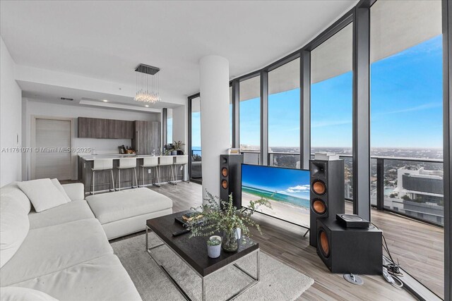 801 S Miami Ave Unit 5509, Miami, FL 33130 - living area featuring floor to ceiling windows and light wood-style floors