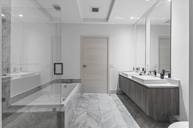 full bathroom featuring a shower with shower door, visible vents, double vanity, tiled tub, and a sink