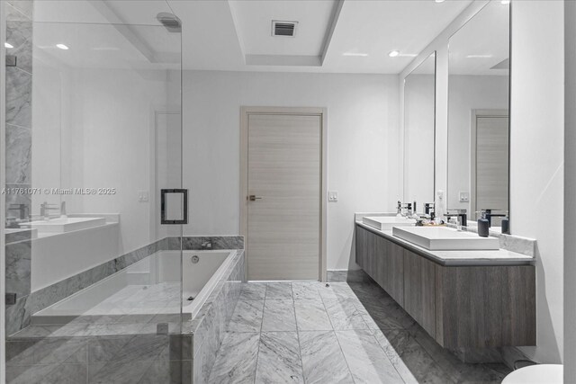 801 S Miami Ave Unit 5509, Miami, FL 33130 - bathroom with marble finish floors, a garden tub, double vanity, and recessed lighting