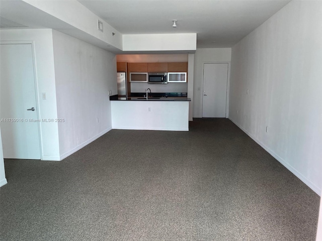 950 Brickell Bay Dr Unit 1600, Miami, FL 33131 - unfurnished living room with baseboards and a sink