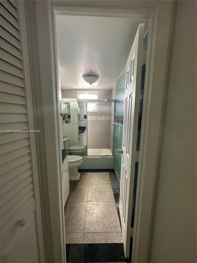 full bathroom featuring vanity, toilet, and shower / bath combination