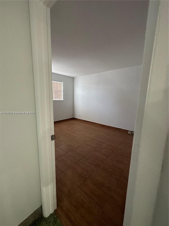 empty room with baseboards