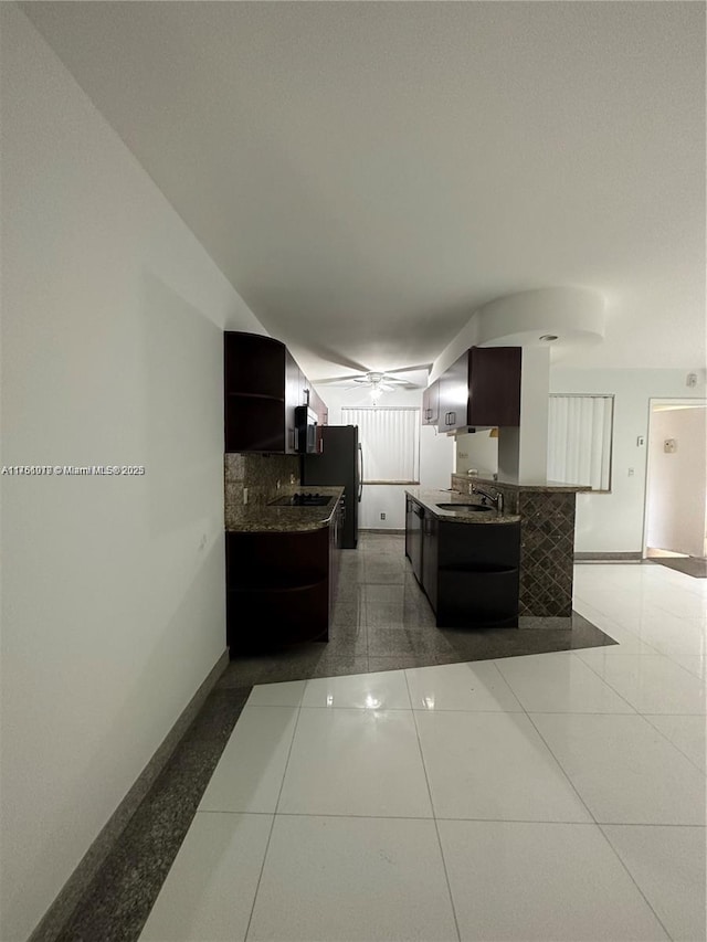 kitchen featuring a sink, open shelves, baseboards, and ceiling fan