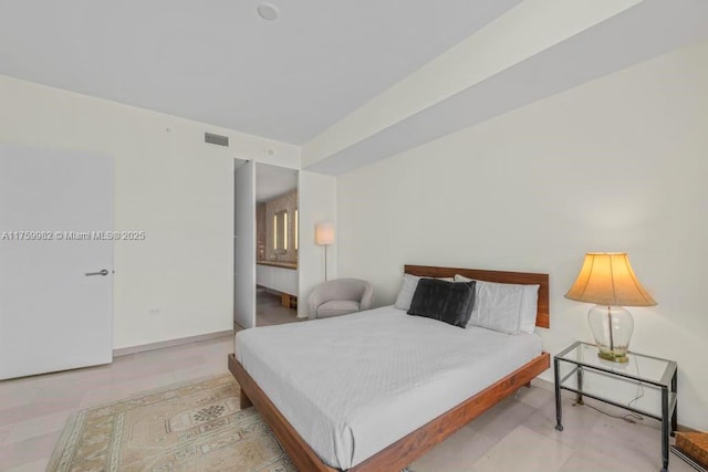 bedroom featuring visible vents and baseboards