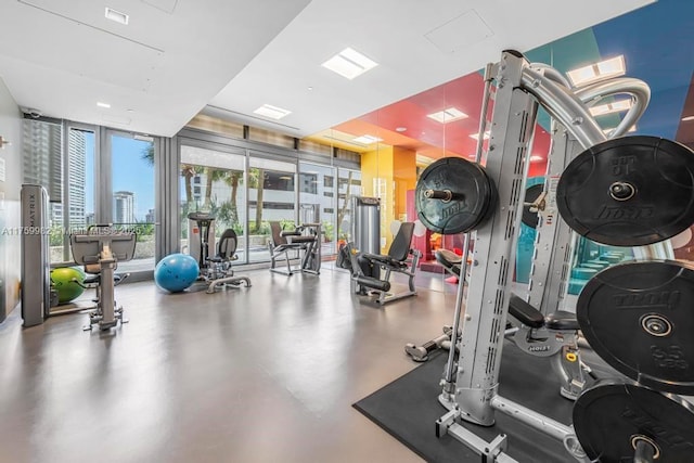 exercise room with floor to ceiling windows and visible vents
