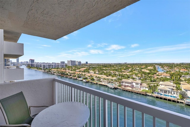 balcony featuring a city view and a water view