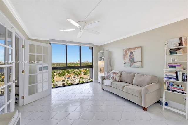 living room featuring expansive windows, baseboards, ceiling fan, and ornamental molding