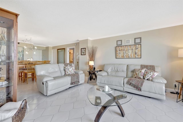 living room featuring a chandelier, baseboards, and ornamental molding