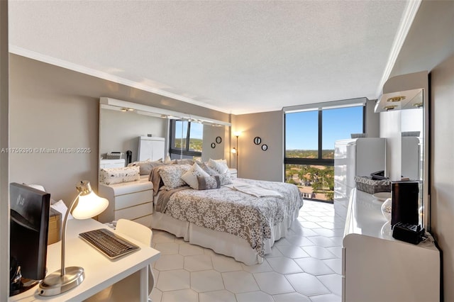 bedroom featuring access to outside, a textured ceiling, a wall of windows, and ornamental molding