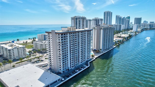 birds eye view of property with a city view and a water view