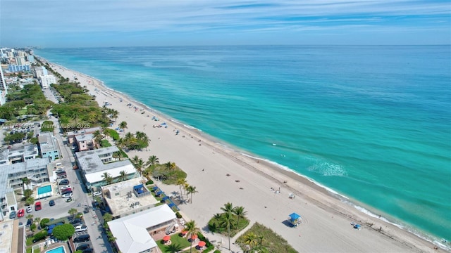 aerial view featuring a water view and a view of the beach