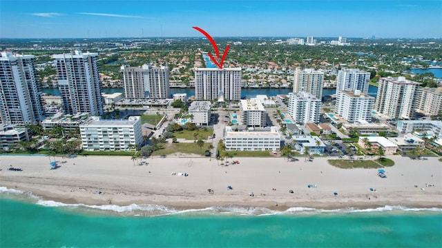 bird's eye view with a city view and a beach view