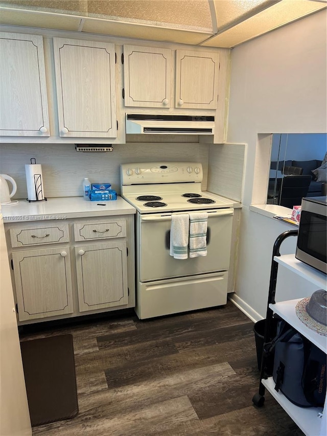 kitchen with stainless steel microwave, under cabinet range hood, dark wood finished floors, light countertops, and white electric stove