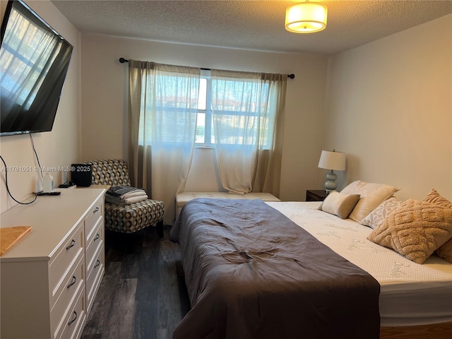 8881 Sunrise Lakes Blvd Unit 108, Sunrise, FL 33322 - bedroom featuring dark wood finished floors and a textured ceiling