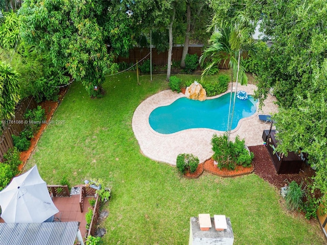 view of pool with a yard, a fenced in pool, and a fenced backyard