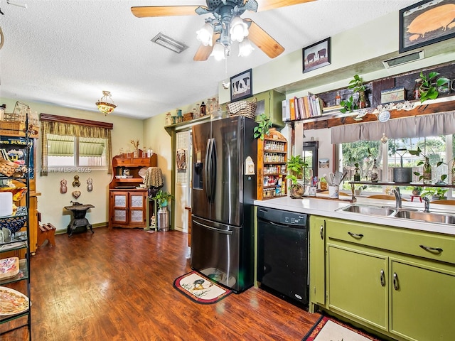 kitchen featuring a sink, stainless steel fridge with ice dispenser, black dishwasher, dark wood-style floors, and green cabinetry